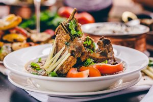 Lamb chops with onion and coconut sauce on a plate at Dakhin Indian Restaurant Glasgow