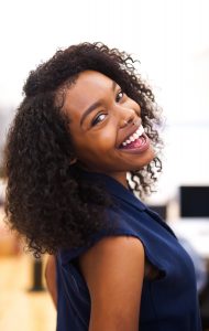 Woman smiling showing off straight white teeth after seeing orthodontist Glasgow